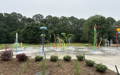 Kids cooling off at White Deer Park Splash Pad in Garner